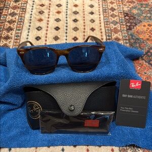 Ray-Ban Tortoise Shell Sunglasses with Black Case. Has prescription lens.
